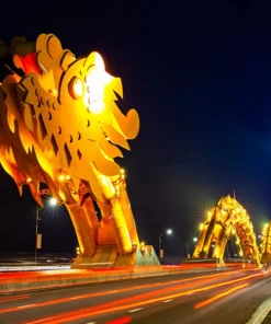 Tien Sa Port to Da Nang by Private Car – Comfortable & Hassle-Free Transfer Dragon Bridge Da Nang at night with colorful lights.