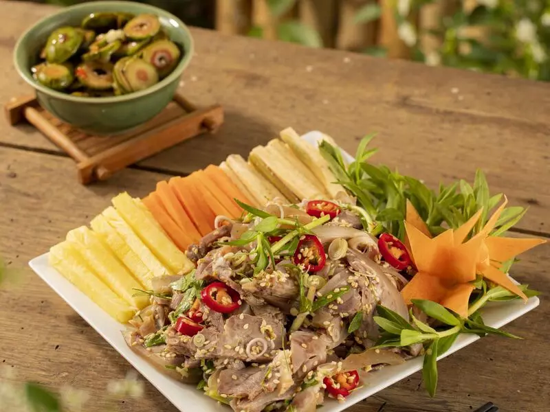 Tam Coc Bich Dong Travel Guide 2025: Top Things to Do, How to Get There & Insider Tips Ninh Bình mountain goat meat served with fresh herbs and rice crackers