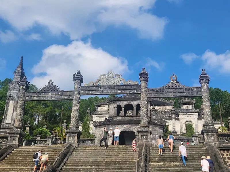 Khai Dinh Tomb: Location, Ticket Price, Architecture & Travel Tips Tam Quan Gate at Khai Dinh Tomb, showcasing the blend of Hinduism, European, and traditional Vietnamese architecture.