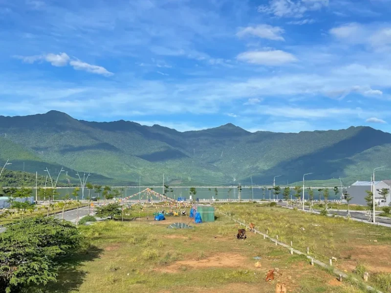 How to Explore Lap An Lagoon in Hue: Full Travel Tips & Guide Tourists camping and fishing by Lap An Lagoon’s sandy shore, with tents, boats, and BBQ at sunset