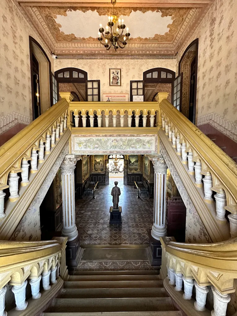 Explore An Dinh Palace in Hue – A Stunning Legacy of Royal Architecture Exterior view of Khải Tường Tower at An Dinh Palace, featuring European architectural style and Romanesque elements