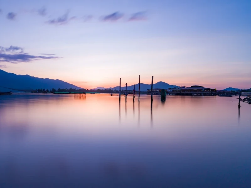 How to Explore Lap An Lagoon in Hue: Full Travel Tips & Guide Peaceful sunrise at Lap An Lagoon in Hue with calm waters reflecting the sky